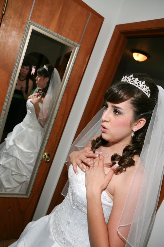 wedding dress with bride in mirrior