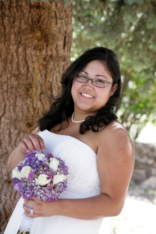 Beautiful bride with lavender wedding bouquet