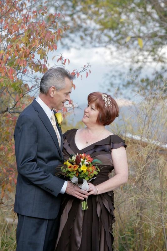 bride and groom and taos mountain