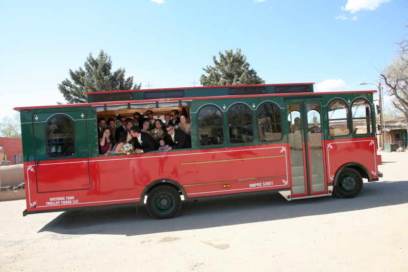 bride and groom rent taos trolley