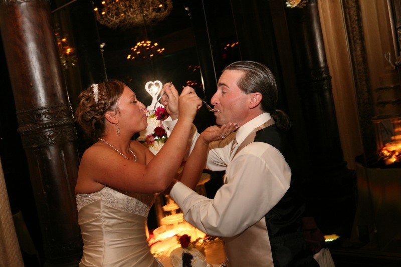 Traditional wedding cake feeding for good luck