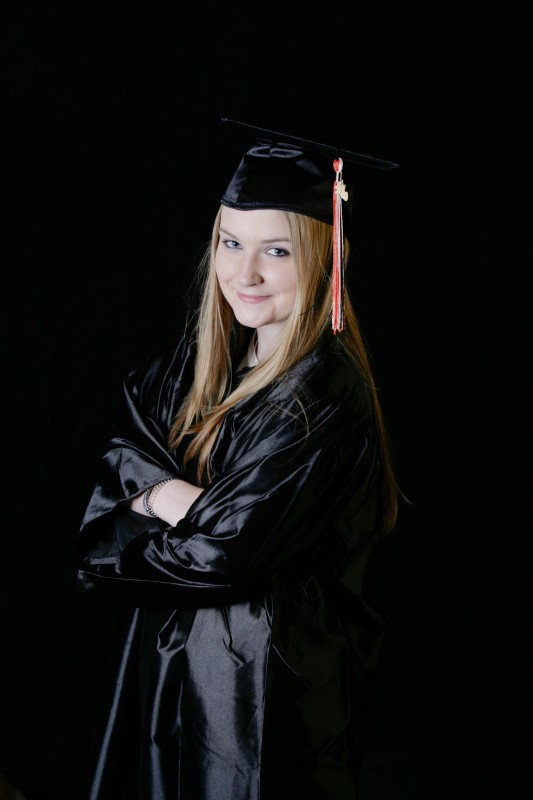 taos senior in gown and hat on graduation day