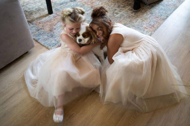 The flowergirls with a Cavalier King Charles spaniel