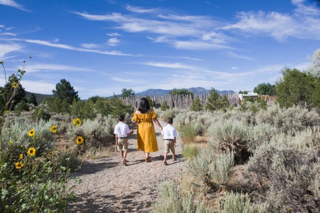 Portrait of mother with her children walking on trail in Taos, NM