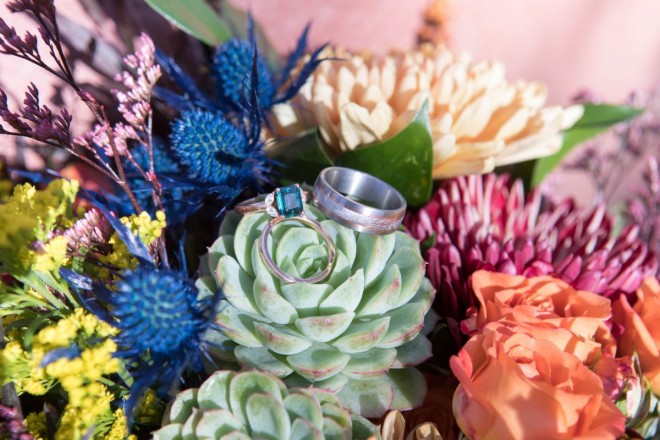 Beautiful succulent in wedding bouquet with wedding rings