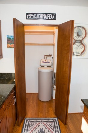 Utility closet off kitchen in quaint condominium in Taos County, NM