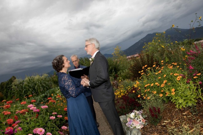 August wedding with grey skies and vibrant flowers