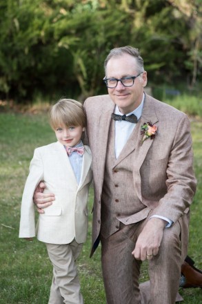 John, the groom, poses with his grandson, the ringbearer