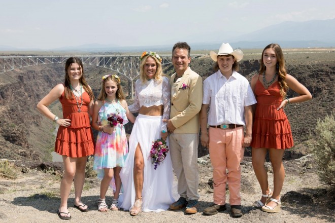 Beautiful family in oranges and turquoise on wedding day in Taos, New Mexico