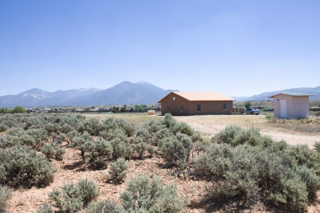Home with small shed with Taos Mountain views in Taos County NM