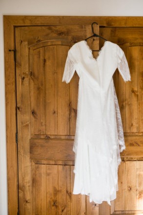 Celeste's dress hanging in front of the closet before the wedding