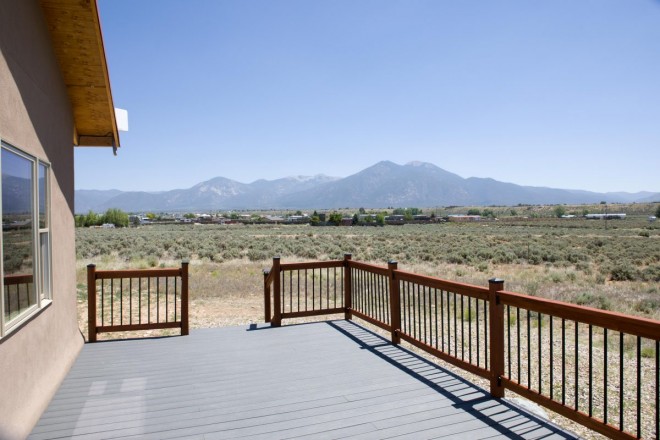 Porch attached to home with views of sacred Taos mountain