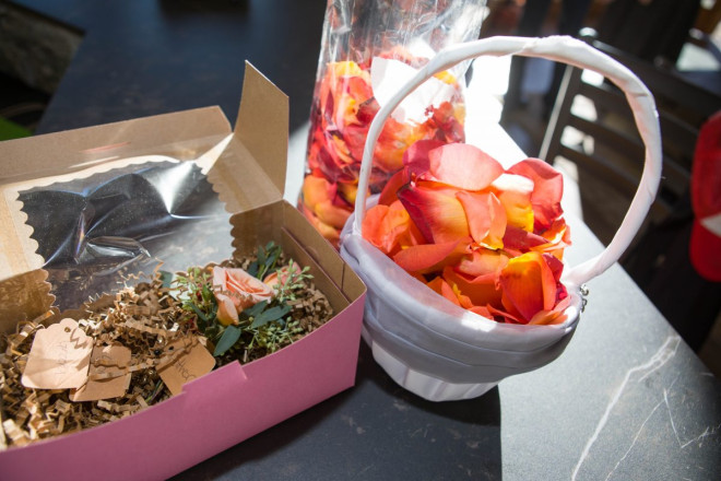 The boutonniere and flower girl's basket with rose petals