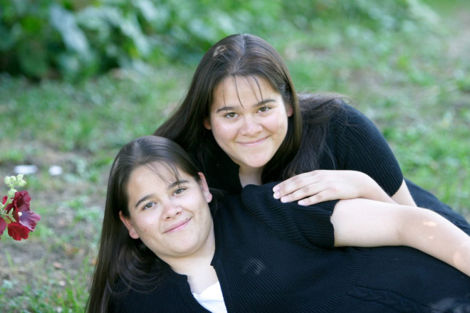 Twin seniors smile during their senior photograph session in Taos, NM