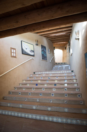 Flagstone stairs and ponderosa viga ceilings at lovely Taos home