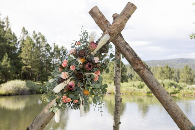 Taos Canyon altar in front of pond with mountains on horizon