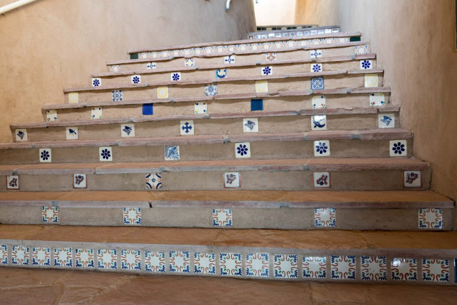 Mexican tile and flagstone art in stairs in Taos, NM home