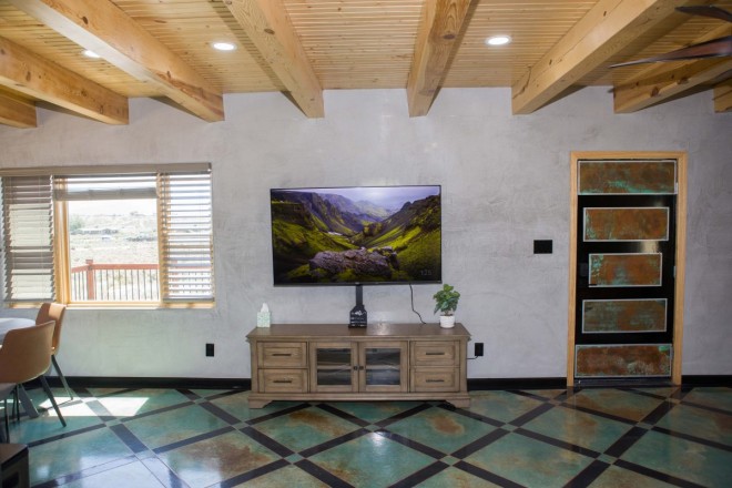 Home in Taos, NM with modern Spanish viga ceilings