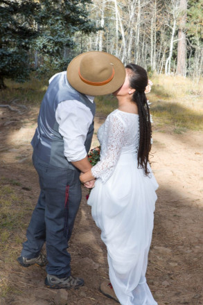 Edwardo gives Sarah a kiss before their October wedding in Taos