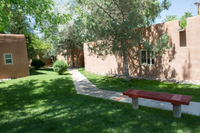 Sidewalks and benches at outdoor condos near Taos plaza