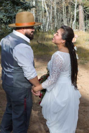 Sarah smiles at Edwardo before their autumn wedding in Valle Escodido