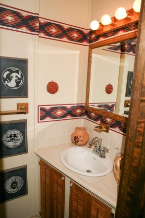Bathroom with southwest design in cabin in Taos