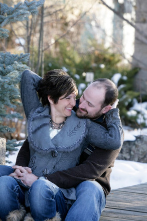 Snowy winter engagement session in jeans and boots