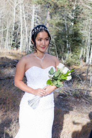 Bride, Chisato, listens to her groom say his vows