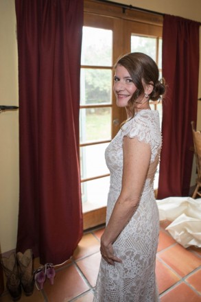 Bride smiles nervously as she anticipates her Taos wedding