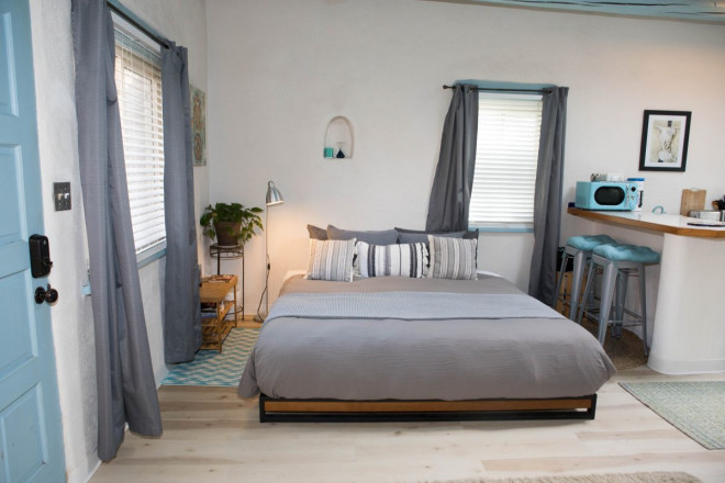 Platform bed in small studio apartment in Taos, NM