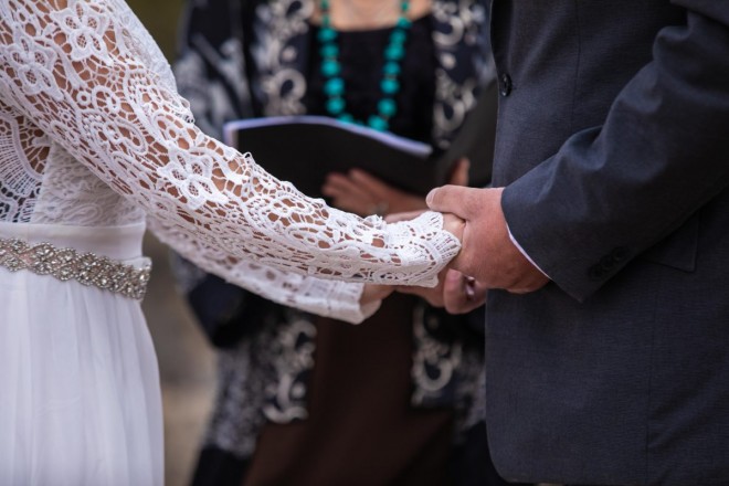 Linsey and Nathan kept each other warm by holding hands during a 50 degrees February wedding ceremony.