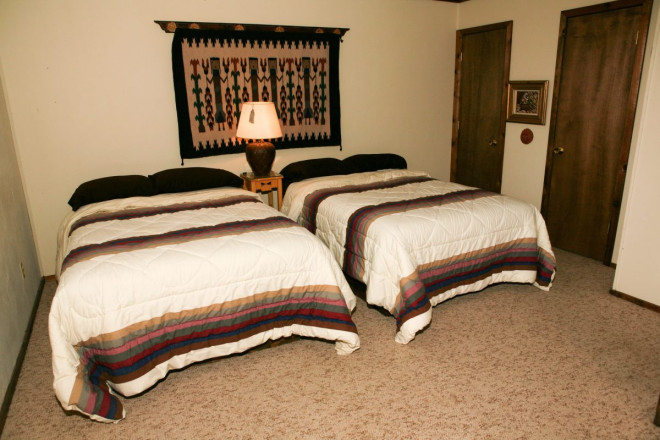 Real estate photography of bedroom in cabin in Taos, NM