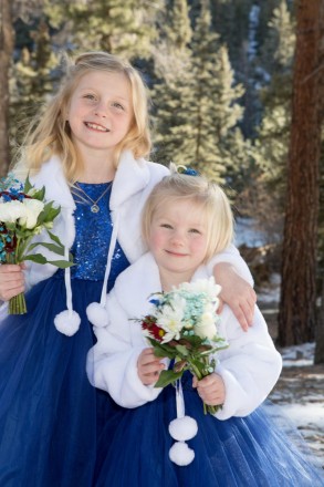Blue eyed sisters with small flower girl wedding bouquets