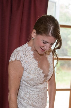Bride and soft lighting in front of window at inn