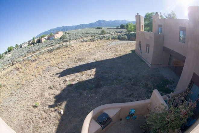 Open fields and mesa surround the Quail Ridge complex in Taos, NM