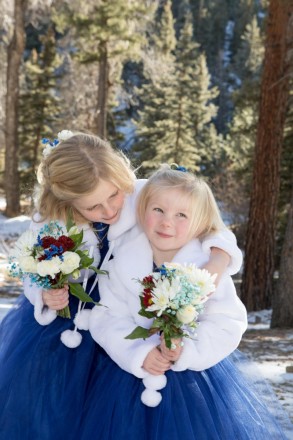 Flower girls with small winter bouquets