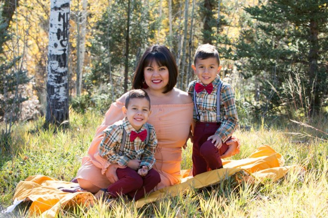 Family portraits in autumn with mom and sons in bowties