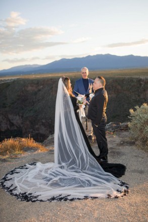 New Mexico bride in a black dress and black lace on her french veil