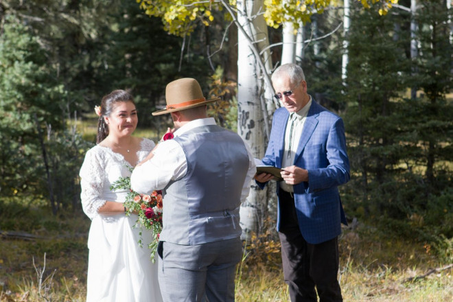 Sarah smiles at Edwardo during their wedding ceremony written by Dan Jones