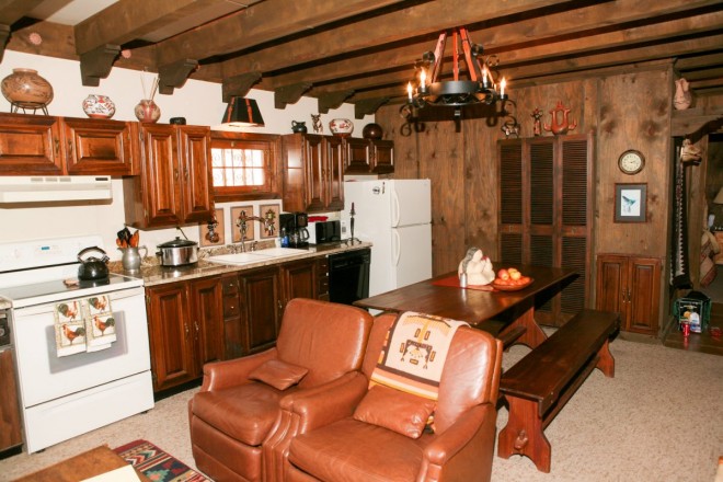 Kitchen and social area in cozy Taos cabin