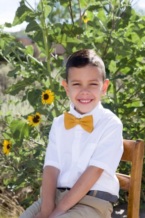 Five years old pictures of Taos boy with sunflowers