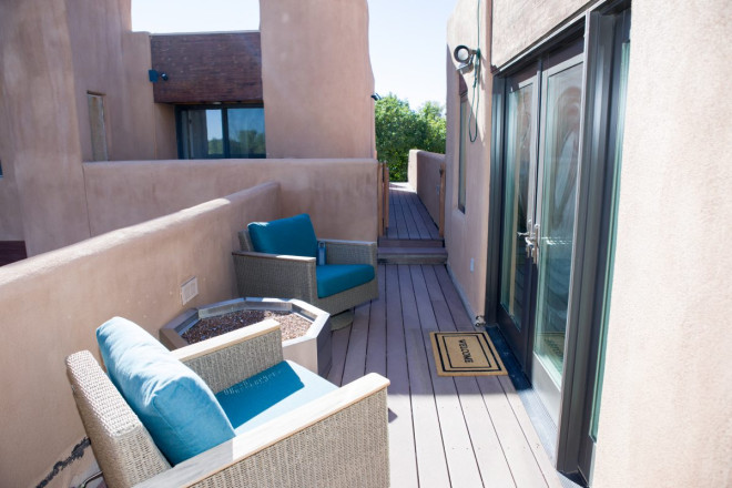 Outdoor entry way at pueblo style condo at Blinking Light in Taos