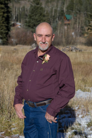 Groom, Joe, with snow on the ground at his October wedding