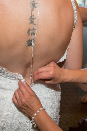 Monica's maid-of-honor buttons Monica's dress during our getting-ready photos.