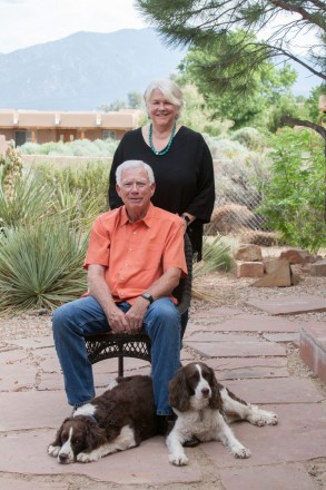 A Taos couple and their calm dogs look at the camera for a Christmas card photo