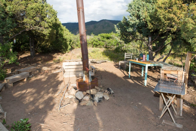View of outdoor kitchen with firepit at campsite near Questa NM