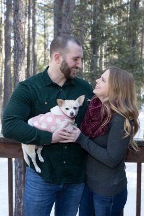 A family with three; mom, dad, and baby chihuahua daughter does a photo shoot in Angel Fire
