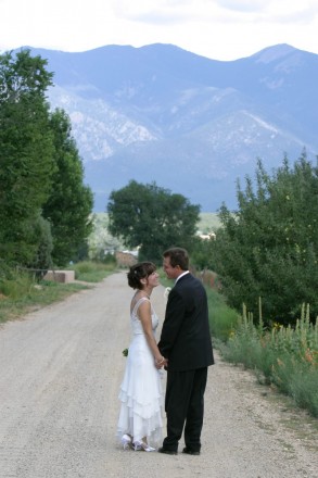 After-wedding walk in apple orchard in Town of Taos
