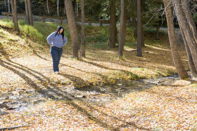 Katy wears lavender during her high school senior pictures session in Red River