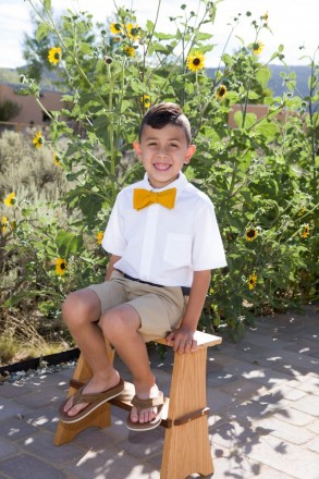 Young New Mexico boy sits on stool for a portrait